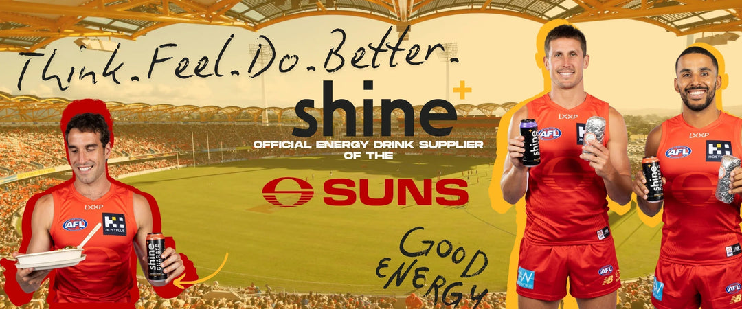 AFL players in red jerseys holding Shine energy drinks at a stadium, text promoting focus and energy.