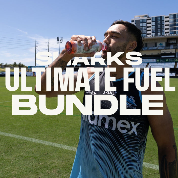 Athlete drinking nootropic beverage on sports field, promoting energy and brain-boosting drinks