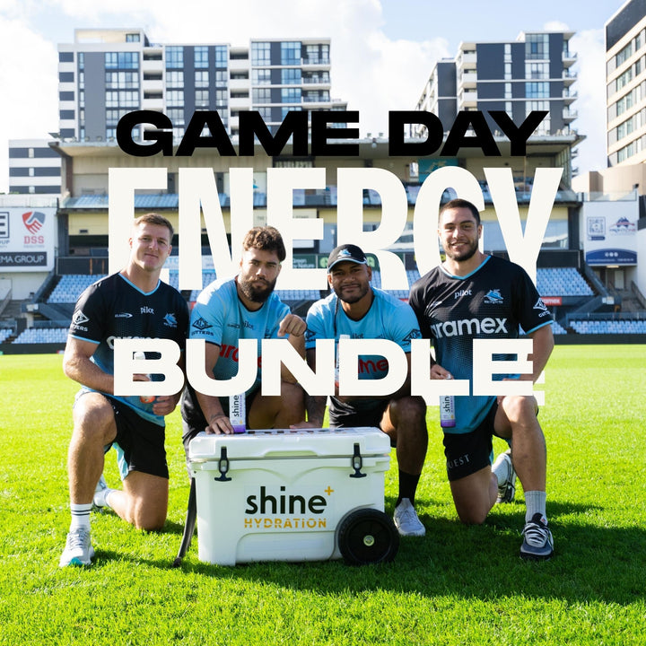 Athletes on sports field with Shine+ Hydration cooler promoting game day energy bundle.