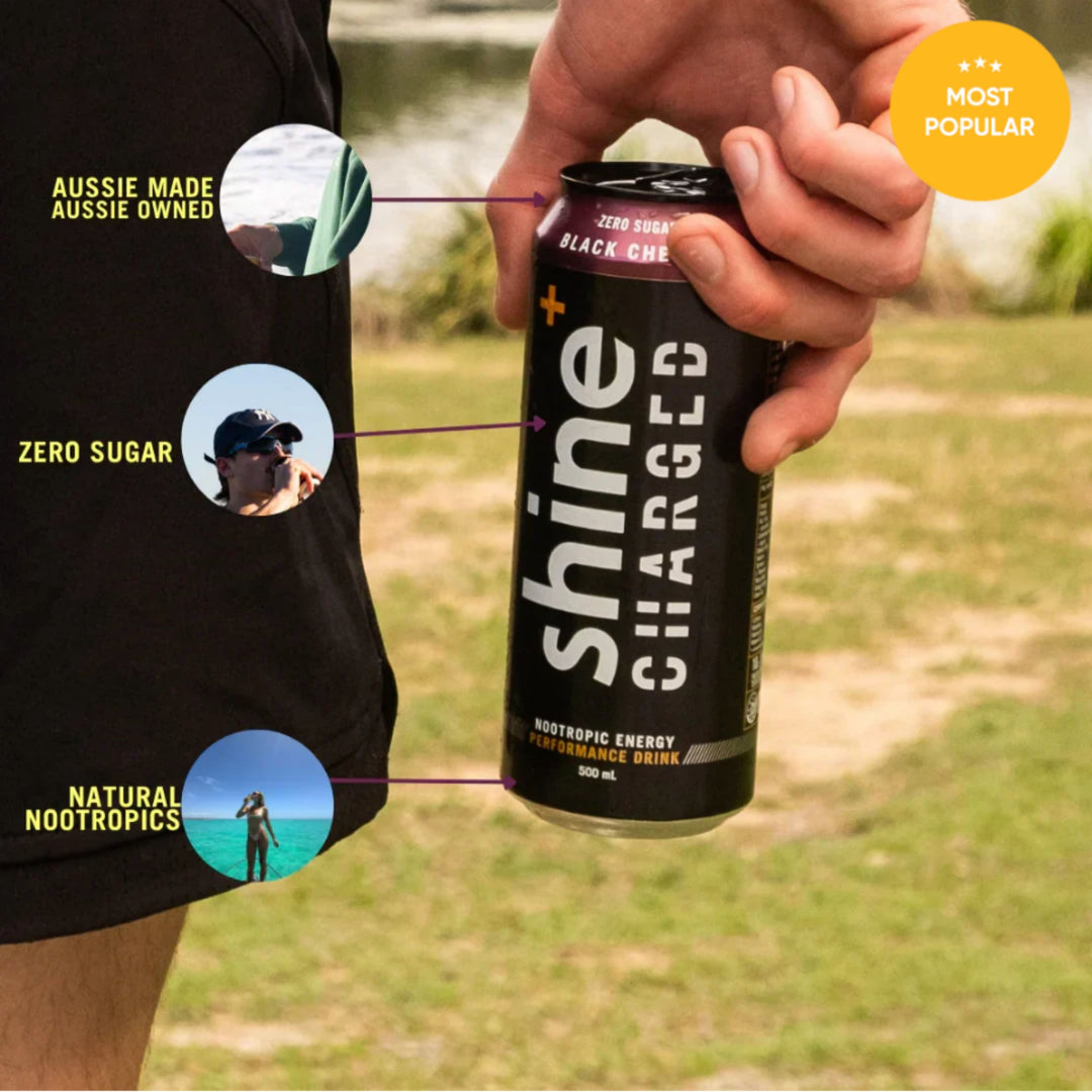 Hand holding can of nootropic energy drink outdoors, labeled zero sugar, natural nootropics.