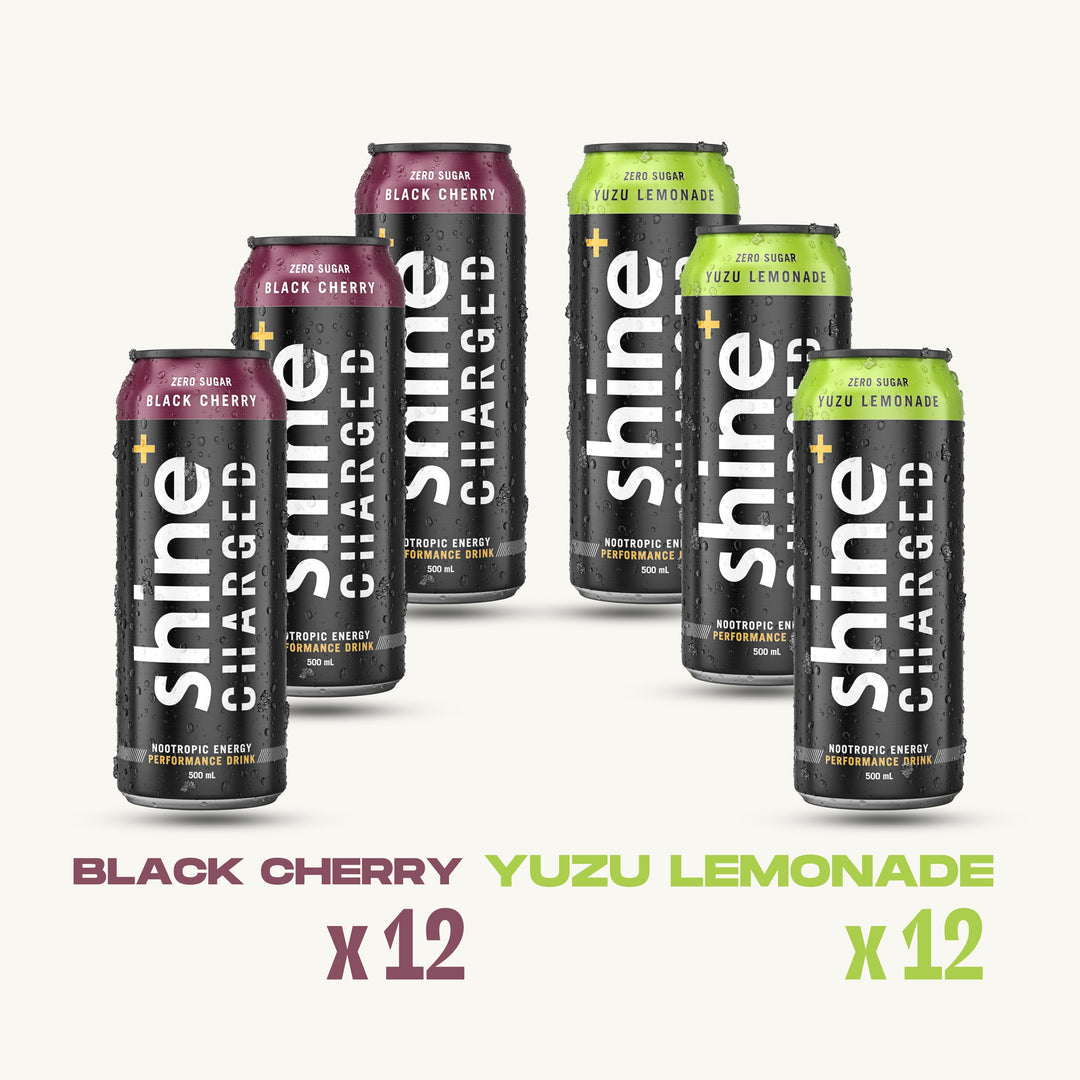 Six cans of Shine Charged nootropic energy drink in Black Cherry and Yuzu Lemonade flavors